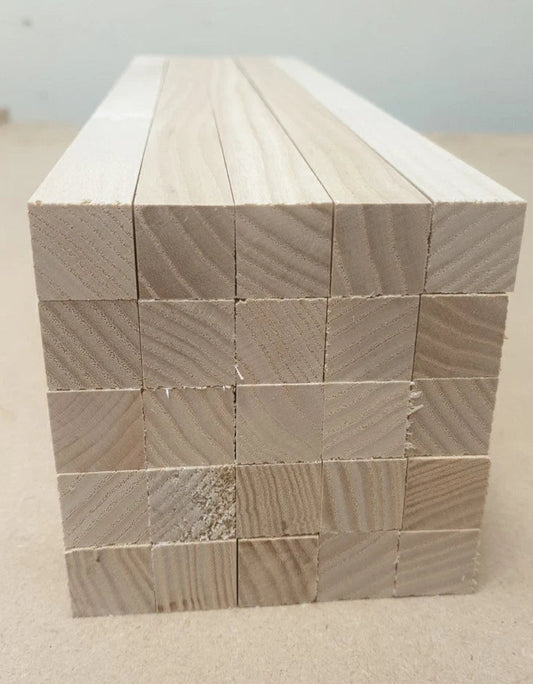 Stack of wooden blocks on a plain surface